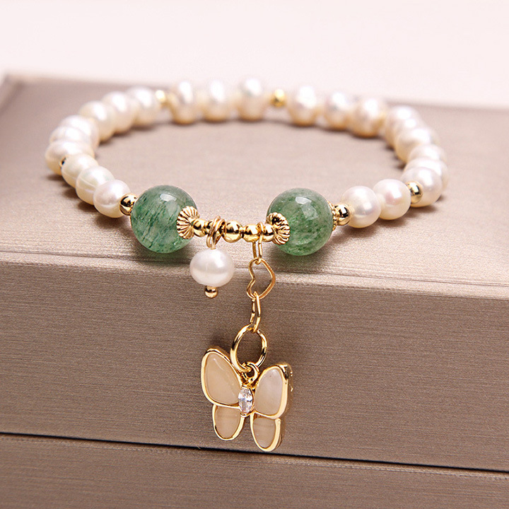 Elegant bracelet featuring freshwater pearls and strawberry quartz, accented with an opal butterfly pendant (Green)