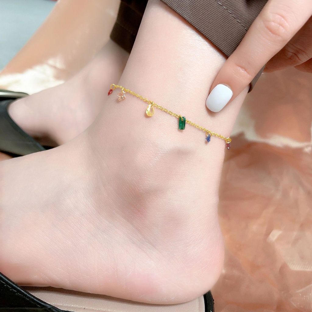 An elegant necklace for women featuring a simple design with colored zircon stones, made from durable titanium steel (Gold Anklet)
